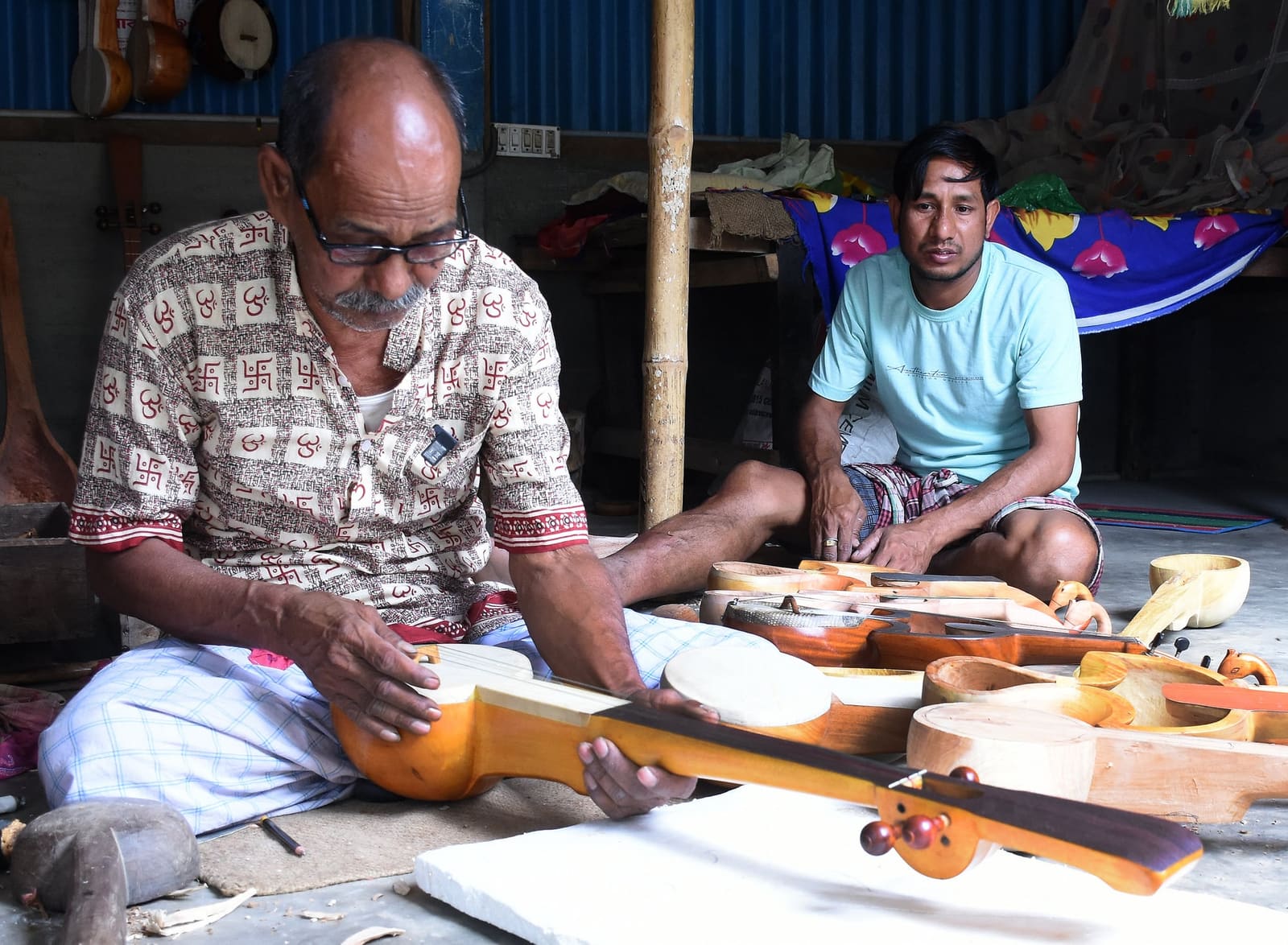 Playing the Dotara. Dotara is a four-stringed musical instrument.